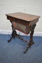 A VICTORIAN ROSEWOOD WORK TABLE, with a hinged lid, that's enclosing various divisions, raised on