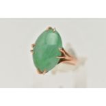 A CHINESE JADE CABOCHON RING, designed as an oval jade cabochon within an eight claw setting to