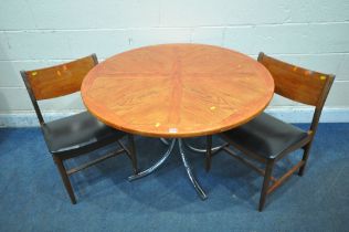 A CIRCULAR TABLE, raised on tubular metal legs, diameter 106cm x height 74cm, along with a pair of