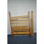 A MODERN PINE 4FT6 BEDSTEAD, with side rails, slats, central support and bolts (condition report: