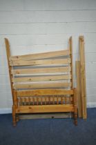 A MODERN PINE 4FT6 BEDSTEAD, with side rails, slats, central support and bolts (condition report: