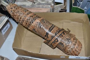 A ROLLED SNAKE SKIN, possibly a python, length approximately 310cm in length and 50cm in width (