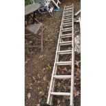 AN ALUMINIUM DOUBLE EXTENSION LADDER with 12 rungs to each 350cm section