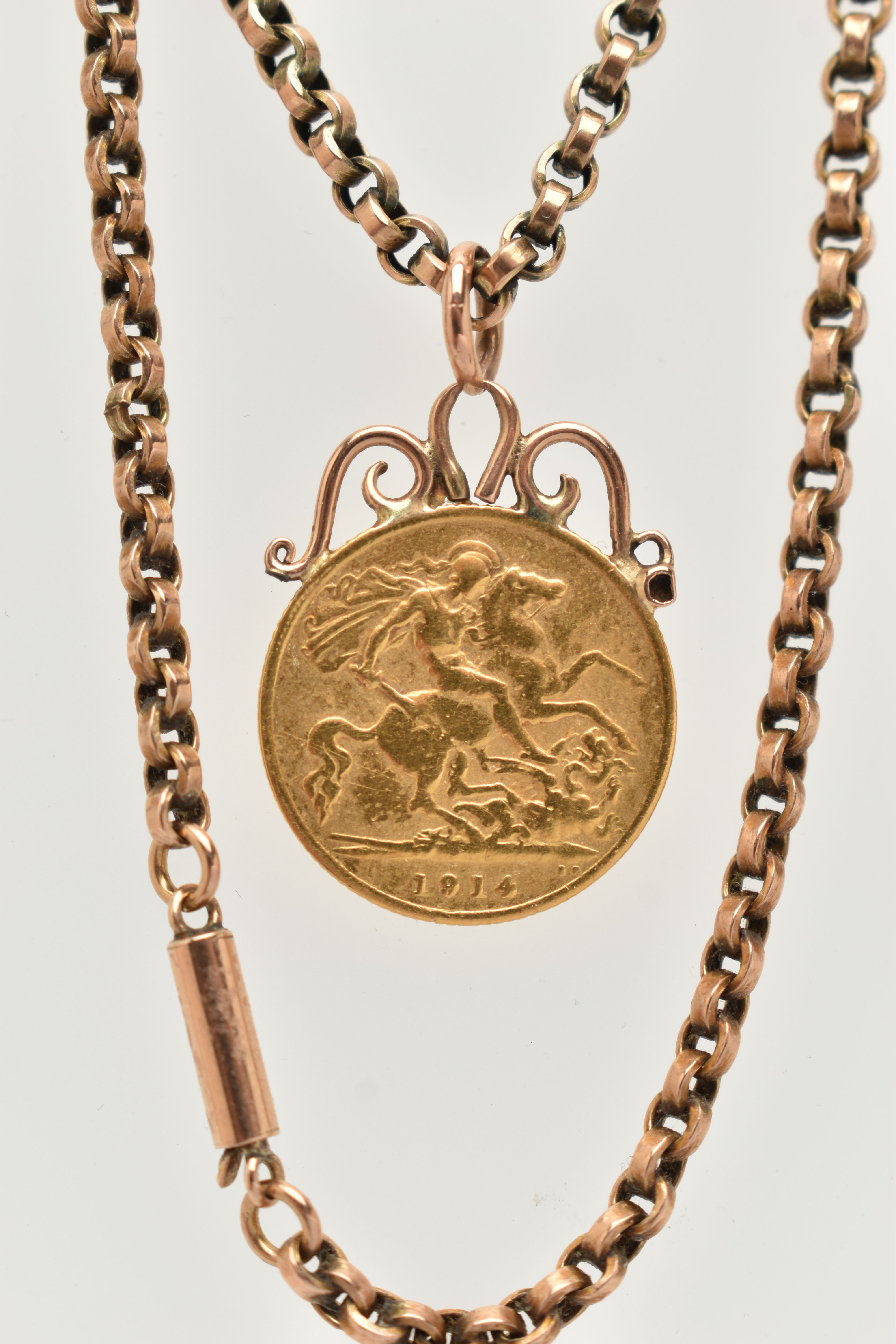 A MOUNTED HALF SOVEREIGN PENDANT AND CHAIN, George V half sovereign, dated 1914, fitted to a