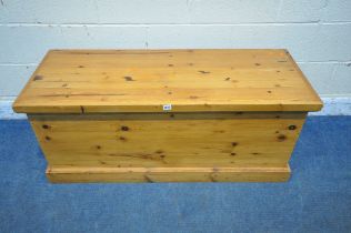 A MODERN PINE BLANKET CHEST, with a hinged lid, width 123cm x depth 46cm x height 52cm (condition