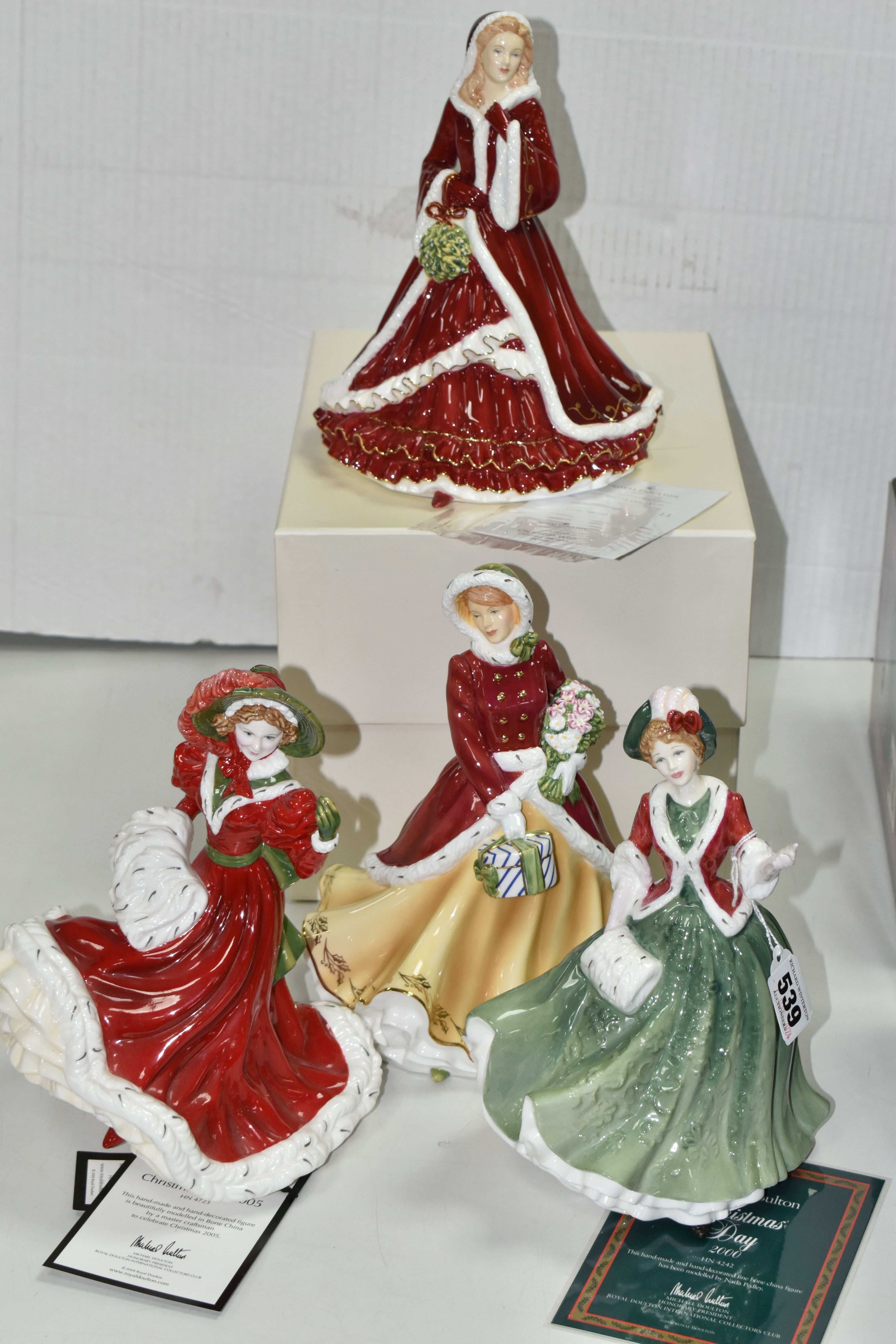 FOUR BOXED ROYAL DOULTON CHRISTMAS DAY FIGURINES, comprising Christmas Day 2000 HN4242, 2005 HN4723,
