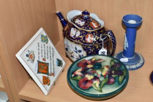 A GROUP OF NAMED CERAMICS, comprising a Moorcroft pottery orchid pattern circular box and cover,