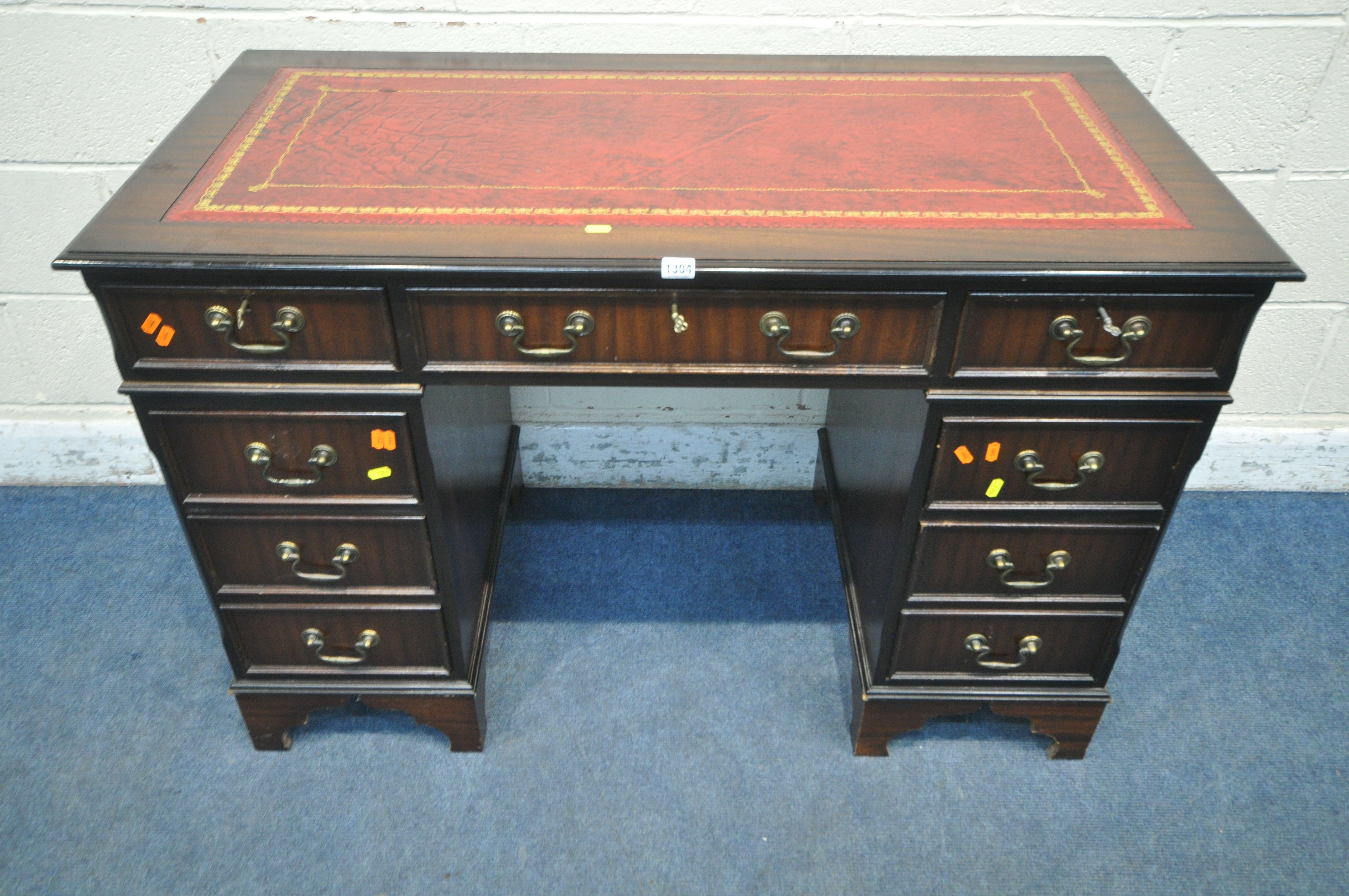 A 20TH CENTURY MAHOGANY TWIN PEDESTAL DESK, with an oxblood leather writing surface, and an