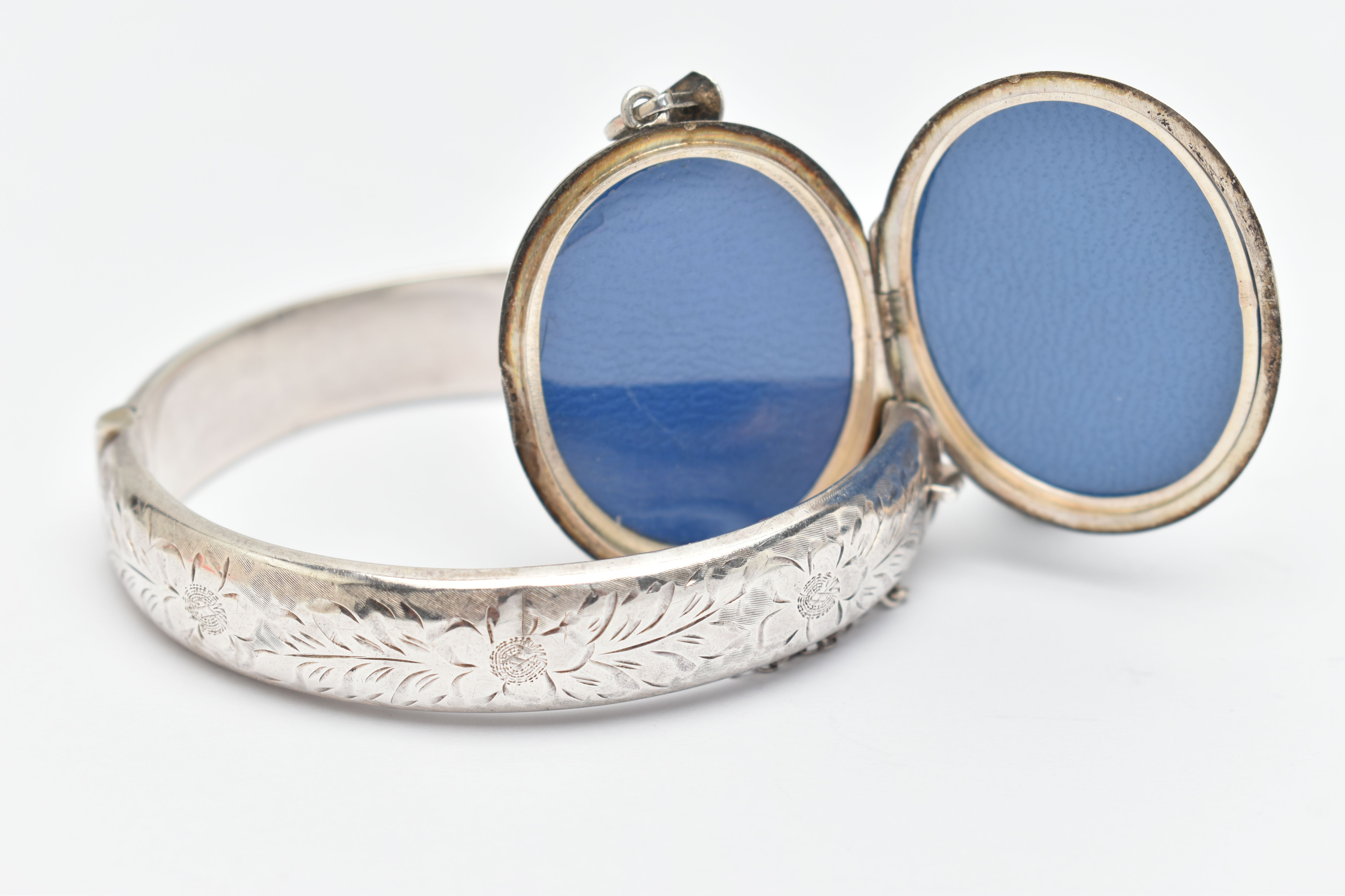 A SILVER HINGED BANGLE AND LOCKET, the bangle with floral pattern, fitted with a push piece - Image 3 of 3