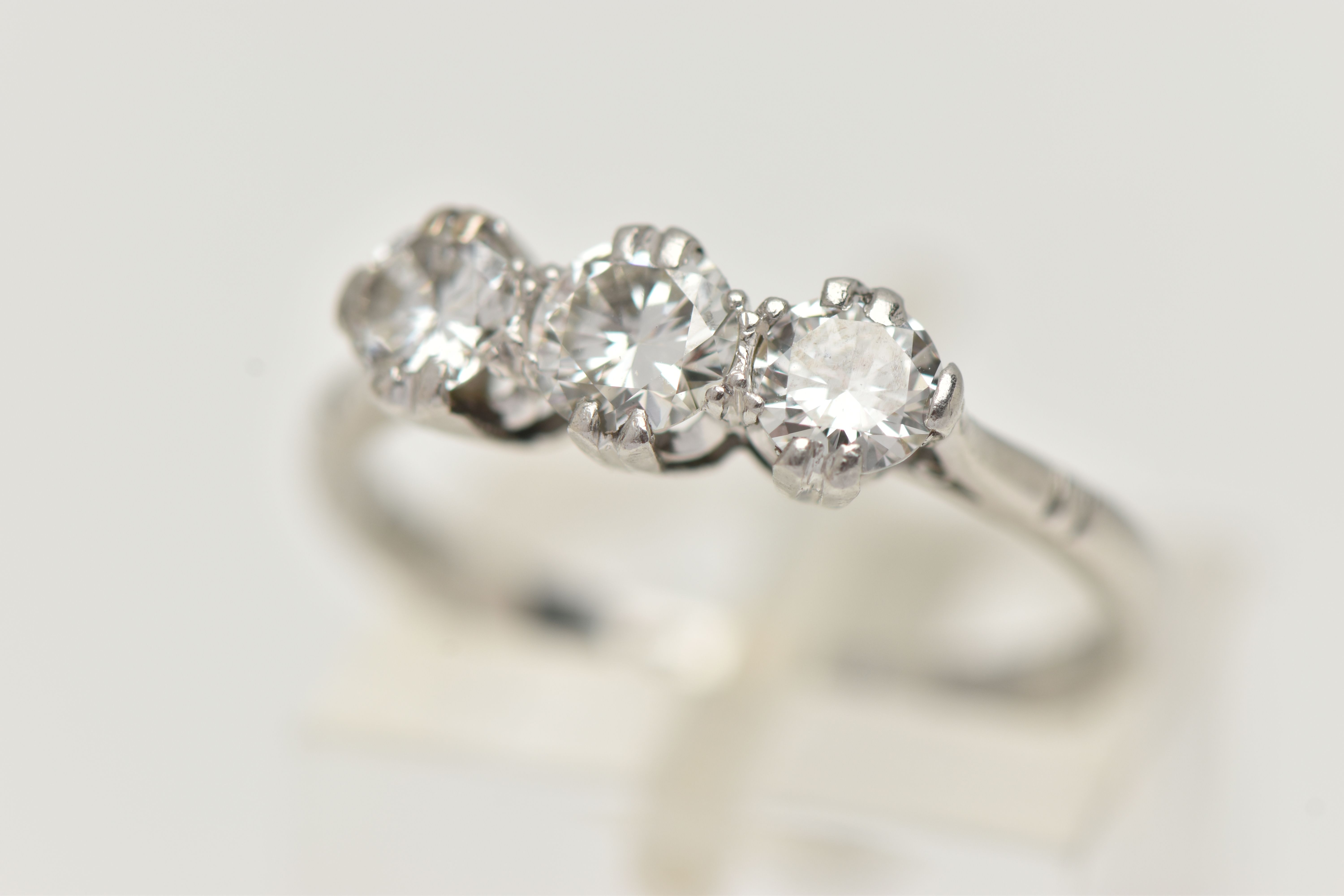A THREE STONE DIAMOND RING, three round brilliant cut diamonds, approximate total diamond weight 0.