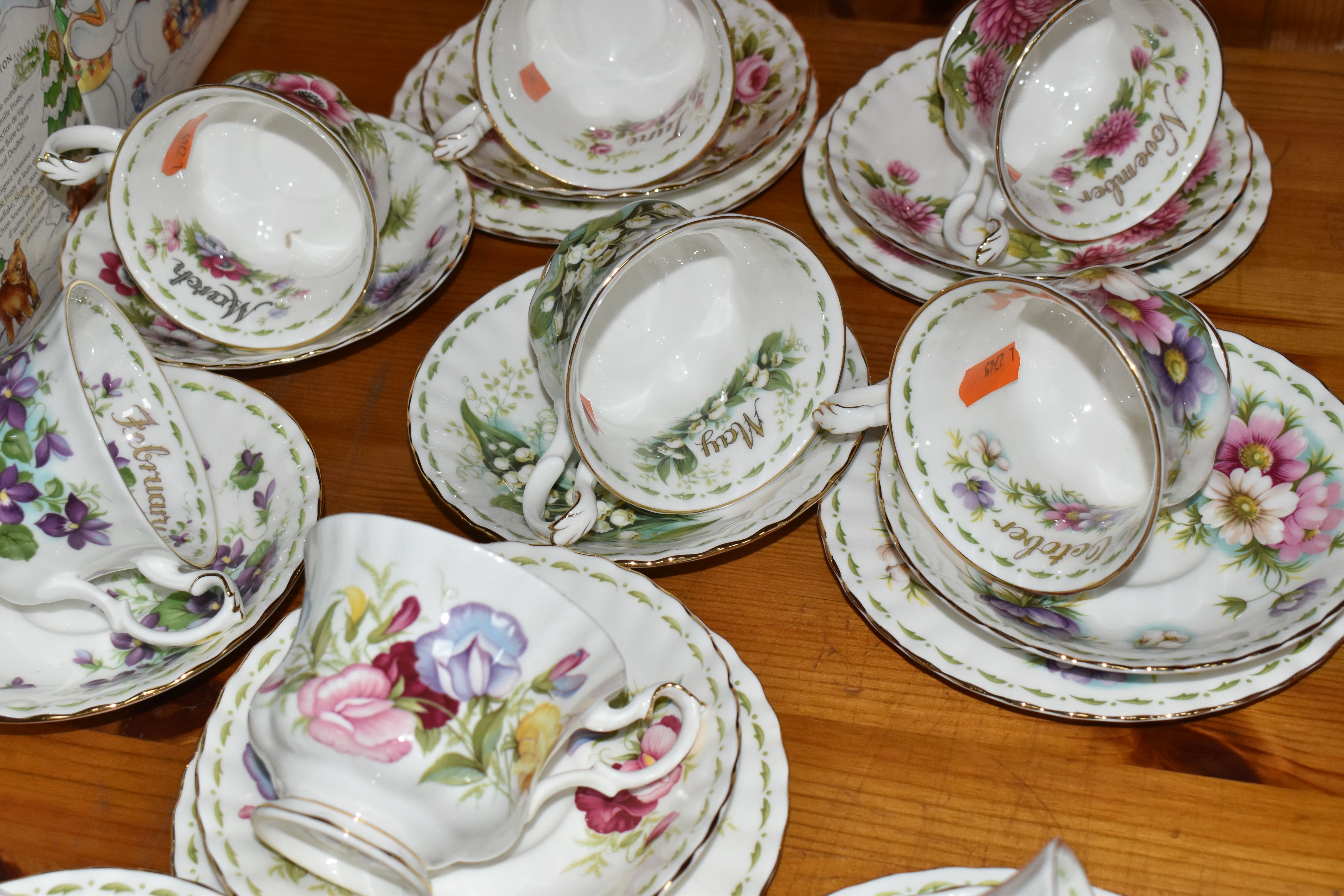 A GROUP OF ROYAL ALBERT 'FLOWER OF THE MONTH SERIES' TEAWARE, comprising a 'Forget Me Not' pattern - Image 6 of 7