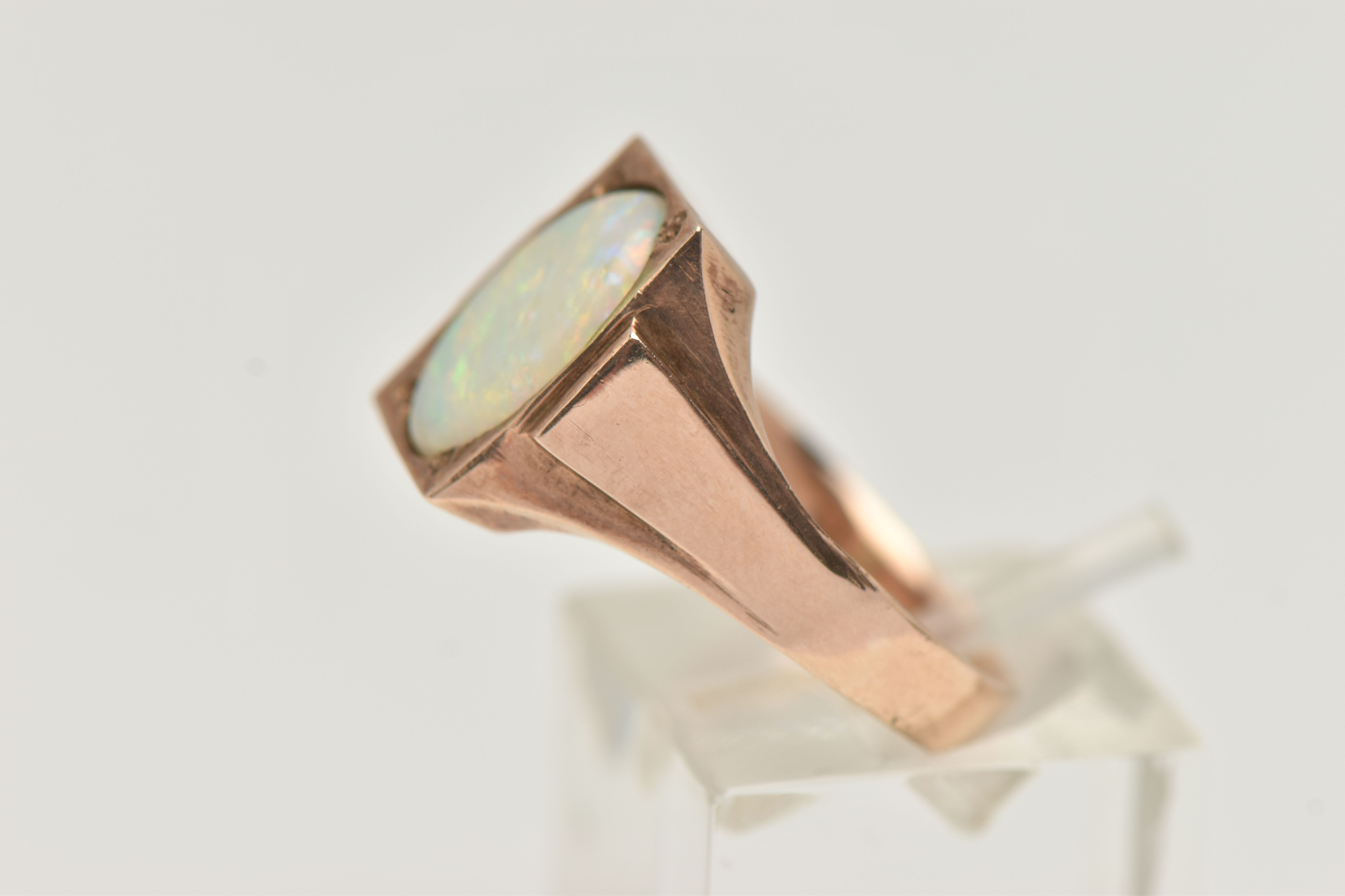 A YELLOW METAL OPAL RING, set with an oval cut white opal cabochon, measuring approximately length - Image 2 of 4