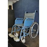 A VINTAGE VESSA WHEELCHAIR with two footrests