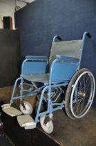A VINTAGE VESSA WHEELCHAIR with two footrests