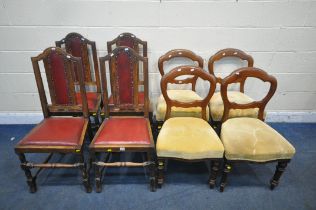A SET OF FOUR 20TH CENTURY OAK DINING CHAIRS, with an arched crest, oxblood leatherette