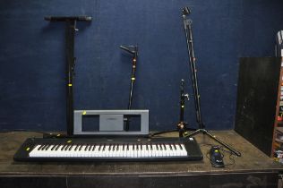 A YAMAHA PIAGGERO NP-32 ELECTRONIC PIANO with Rock Jam Sustain pedal, keyboard stand, instrument