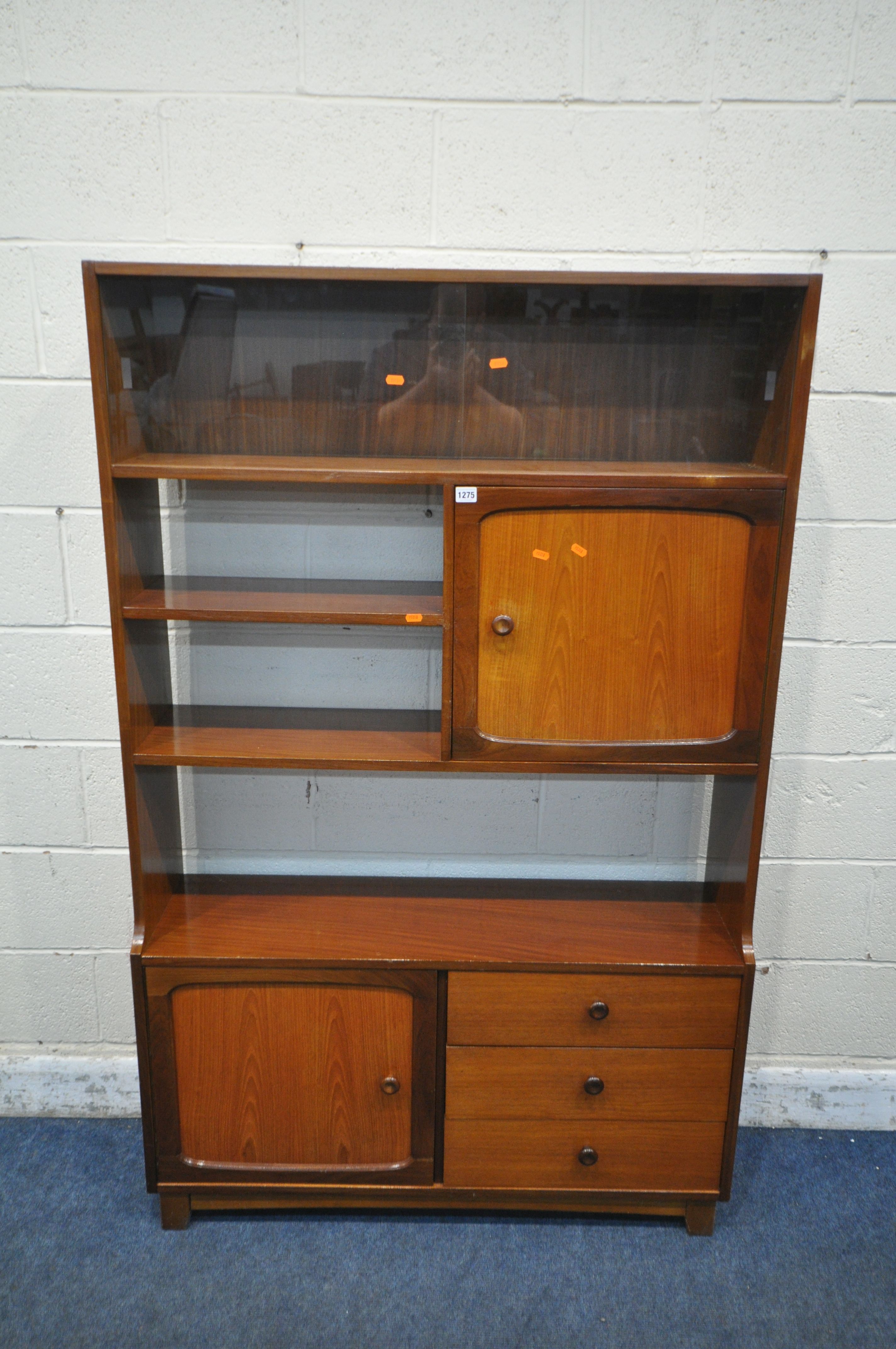 STATEROOM BY STONEHILL, A MID CENTURY TEAK BOOKCASE, with double glazed sliding doors, an