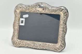 A SILVER FRONTED PICTURE FRAME, rectangular form frame, with embossed floral and foliage detail,