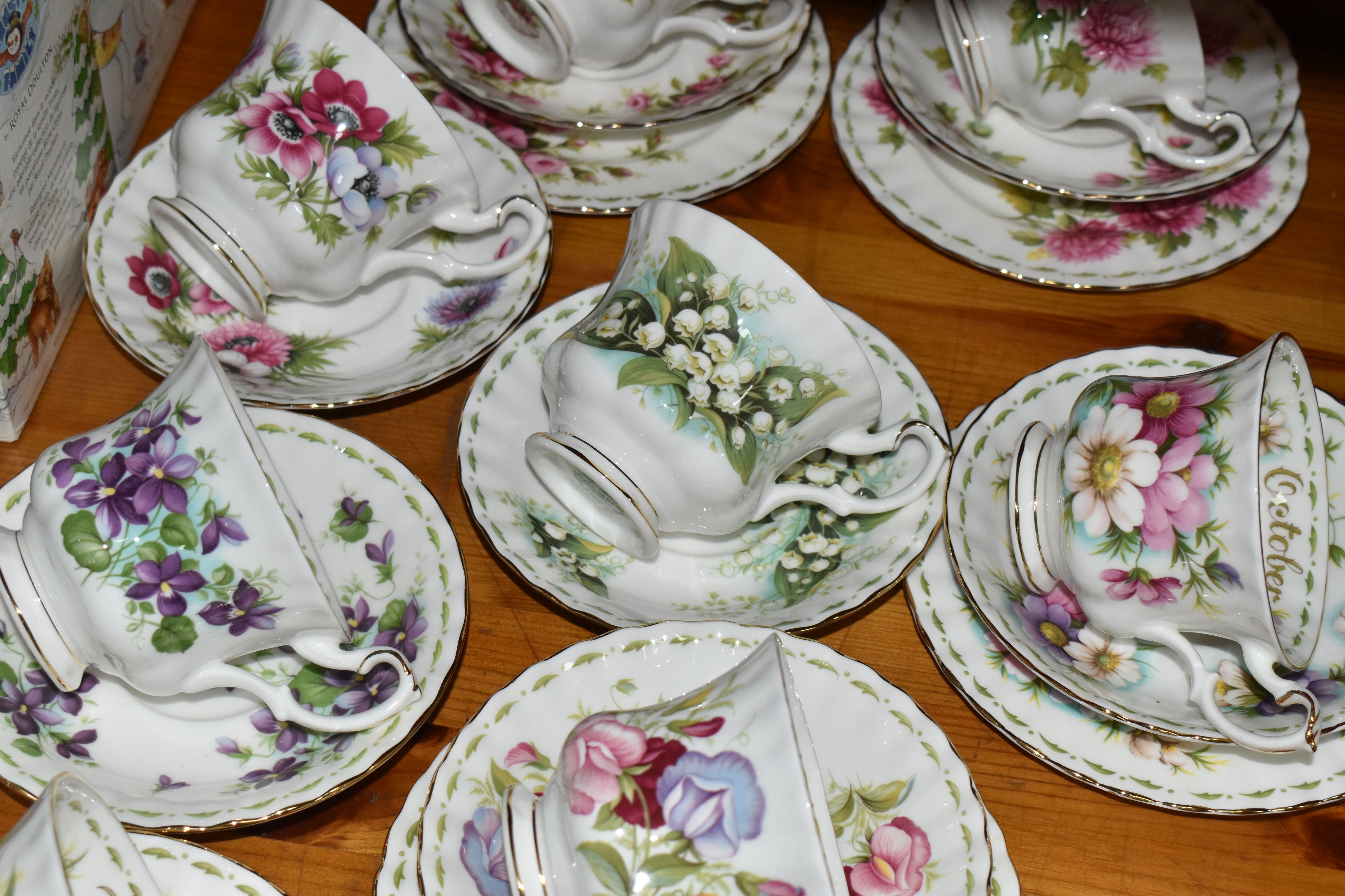 A GROUP OF ROYAL ALBERT 'FLOWER OF THE MONTH SERIES' TEAWARE, comprising a 'Forget Me Not' pattern - Image 2 of 7