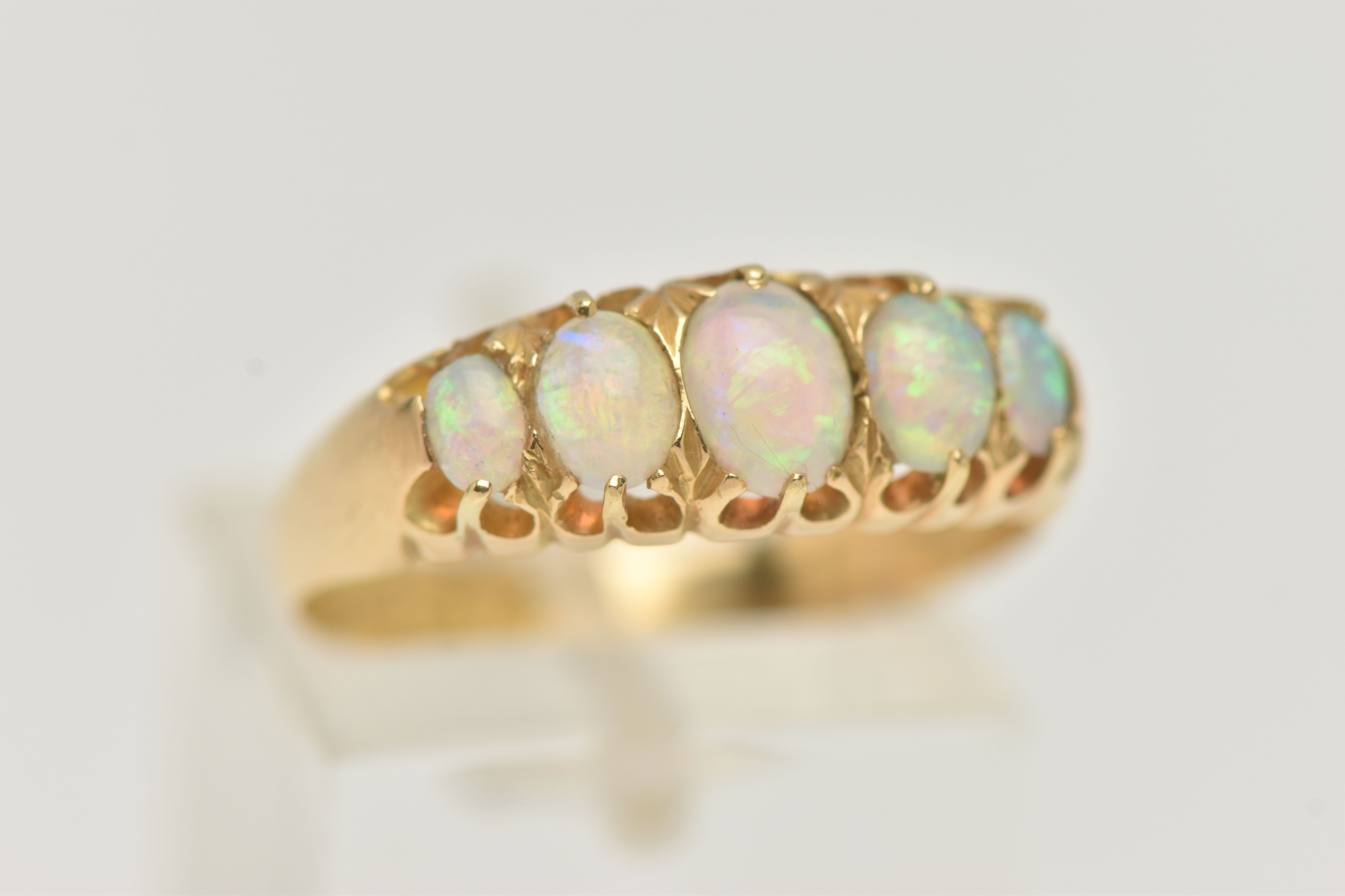 AN EARLY 20TH CENTURY, 18CT GOLD OPAL FIVE STONE RING, set with five graduated oval cut, opal - Image 4 of 4