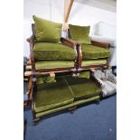 AN EARLY 20TH CENTURY MAHOGANY THREE PIECE LOUNGE SUITE, comprising a two seater sofa, with green