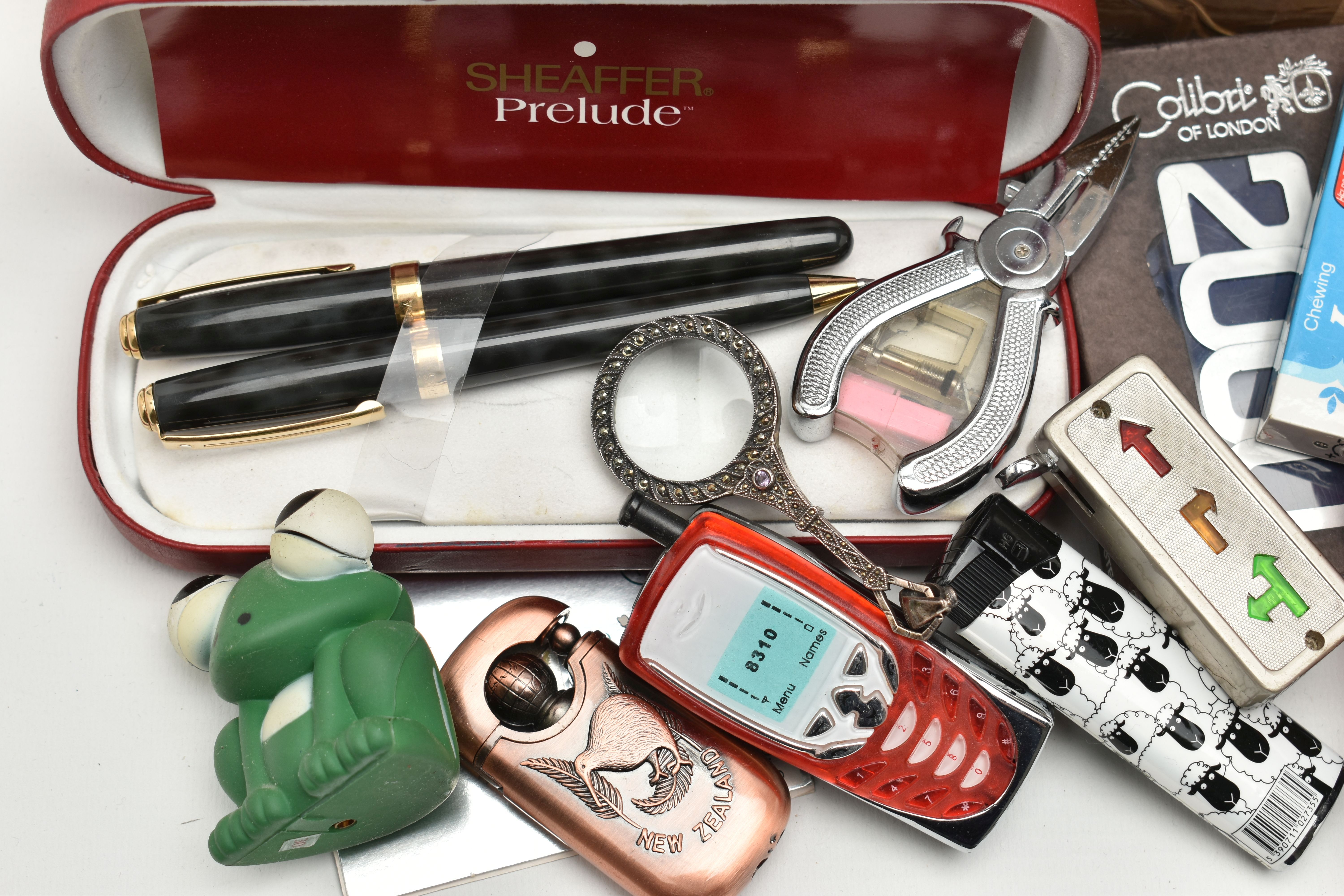 A BOX OF ASSORTED ITEMS, to include various novelty lighters, in forms such as a phone, chocolate, - Image 4 of 5