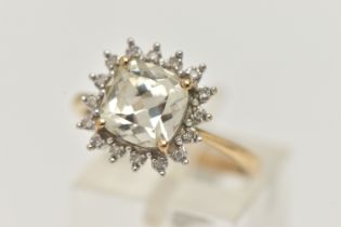 A 9CT GOLD GEM SET CLUSTER RING, mixed cushion cut colourless stone, possibly topaz, measuring