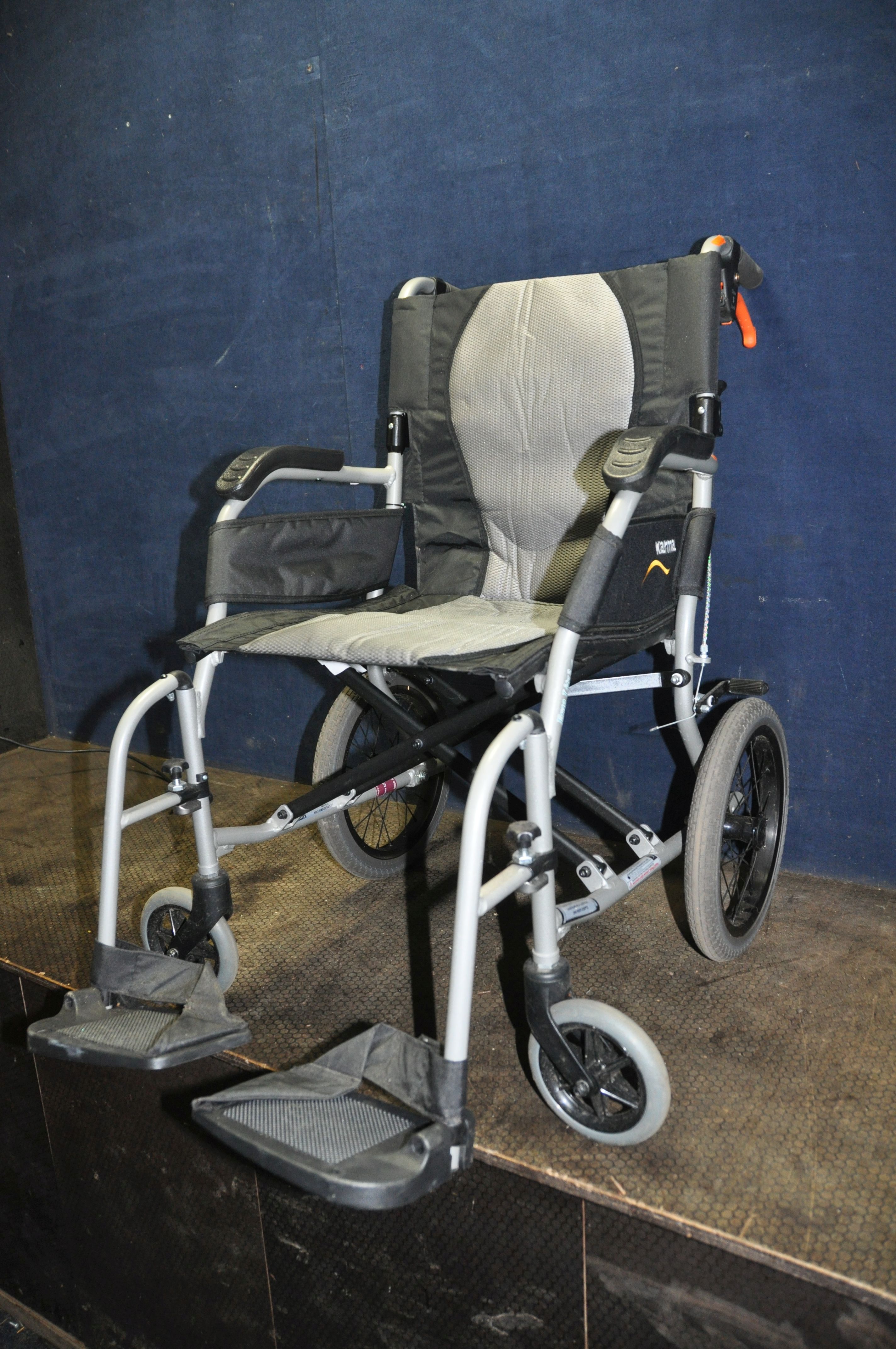 A KARMA ERGO LITE 2 MOBILITY FOLDING WHEELCHAIR with two footrests