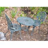 A GREEN PAINTED CAST ALUMINIUM GARDEN TABLE 60cm in diameter with a pair of similar chairs (