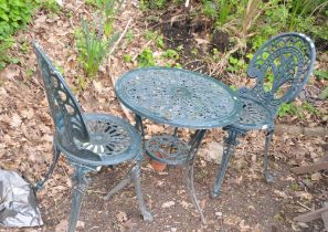 A GREEN PAINTED CAST ALUMINIUM GARDEN TABLE 60cm in diameter with a pair of similar chairs (