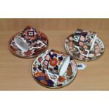 THREE ROYAL CROWN DERBY COFFEE CANS AND SAUCERS, from 'The Curator's Collection' in Rich Japan,