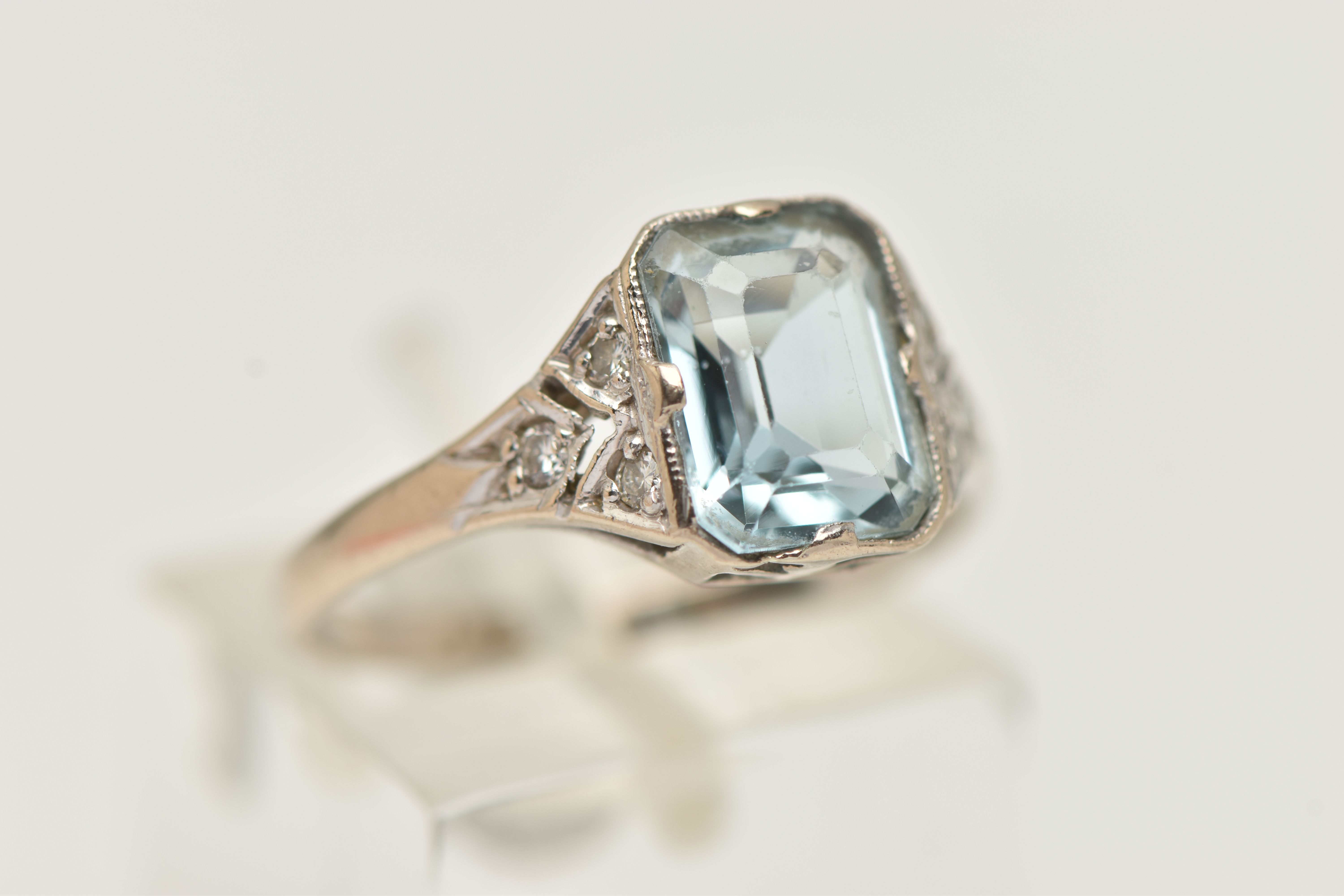 AN AQUAMARINE AND DIAMOND RING, principally set with a rectangular cut aquamarine, approximate - Image 4 of 4