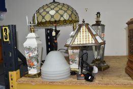 A GROUP OF TABLE LAMPS, comprising a modern figural lamp with leaded effect shade, total height