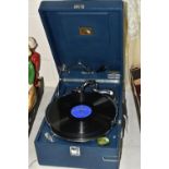 A 1930s HMV MODEL 102 WIND UP GRAMOPHONE IN BLUE PORTABLE CASE, including twelve LPs featuring