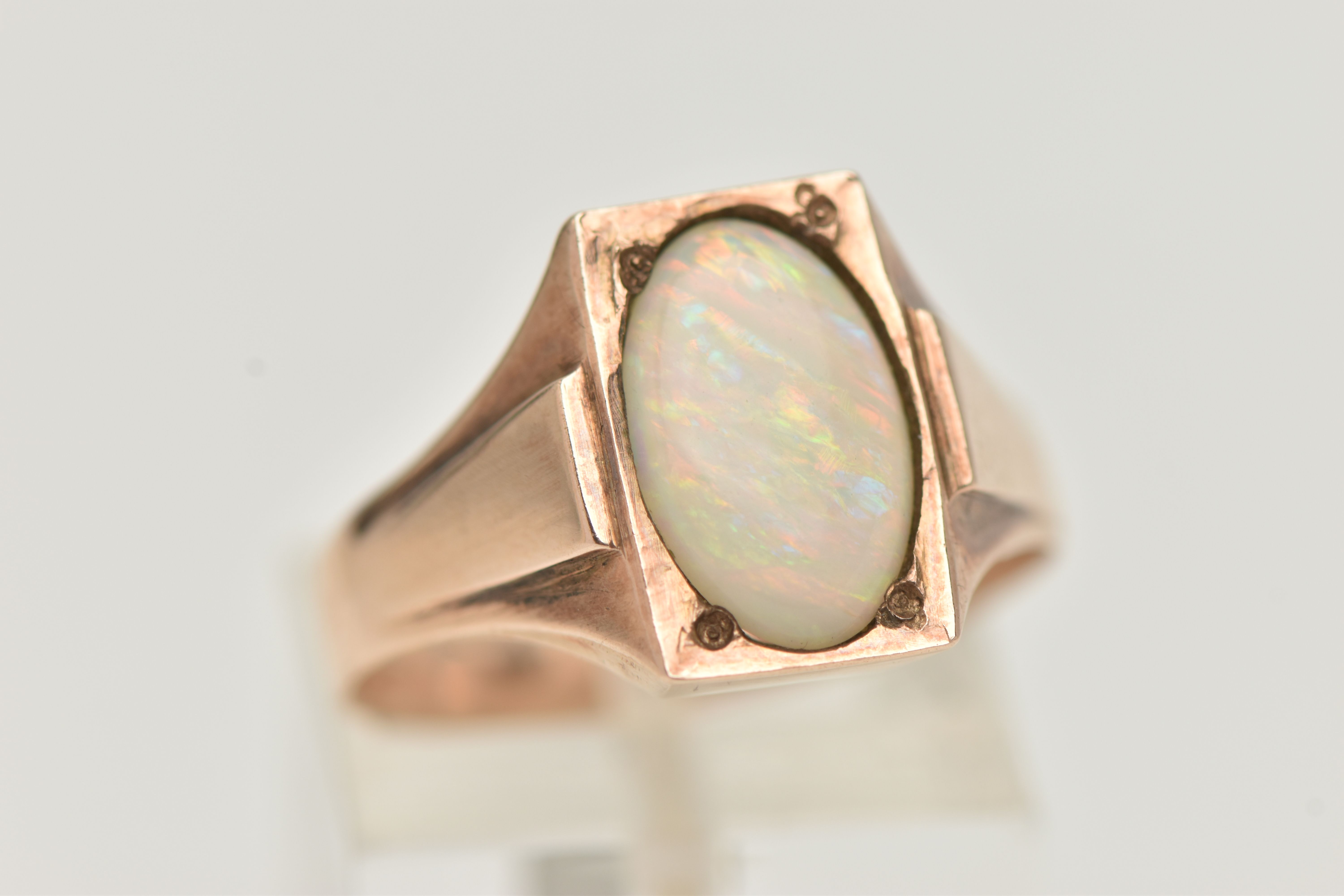 A YELLOW METAL OPAL RING, set with an oval cut white opal cabochon, measuring approximately length - Image 4 of 4