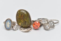 EIGHT WHITE METAL RINGS, various designs, some set with semi-precious gemstones or paste,