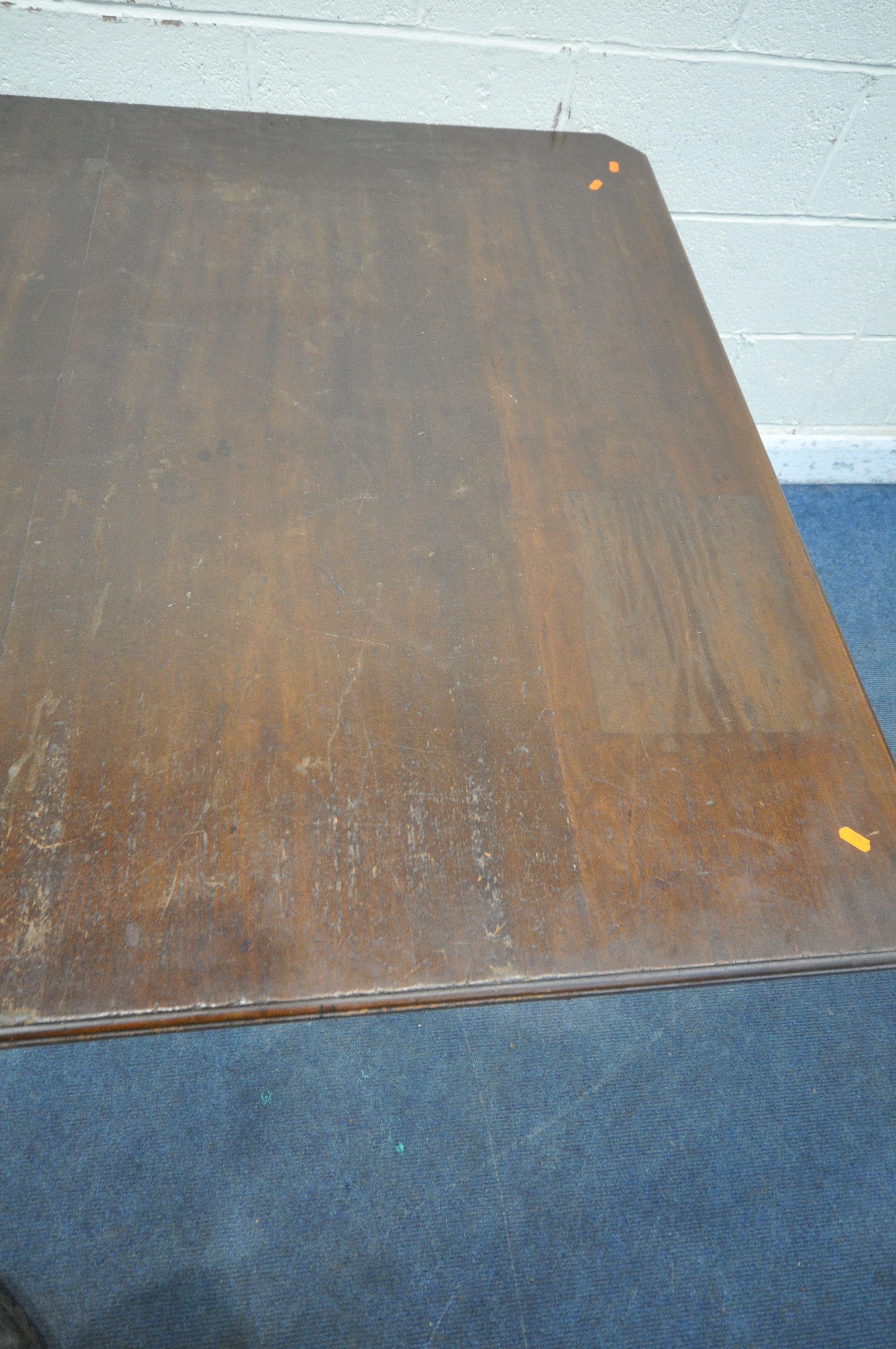 A VICTORIAN WIND OUT DINING TABLE, with canted corners, raised on turned and reeded legs, with - Image 3 of 4
