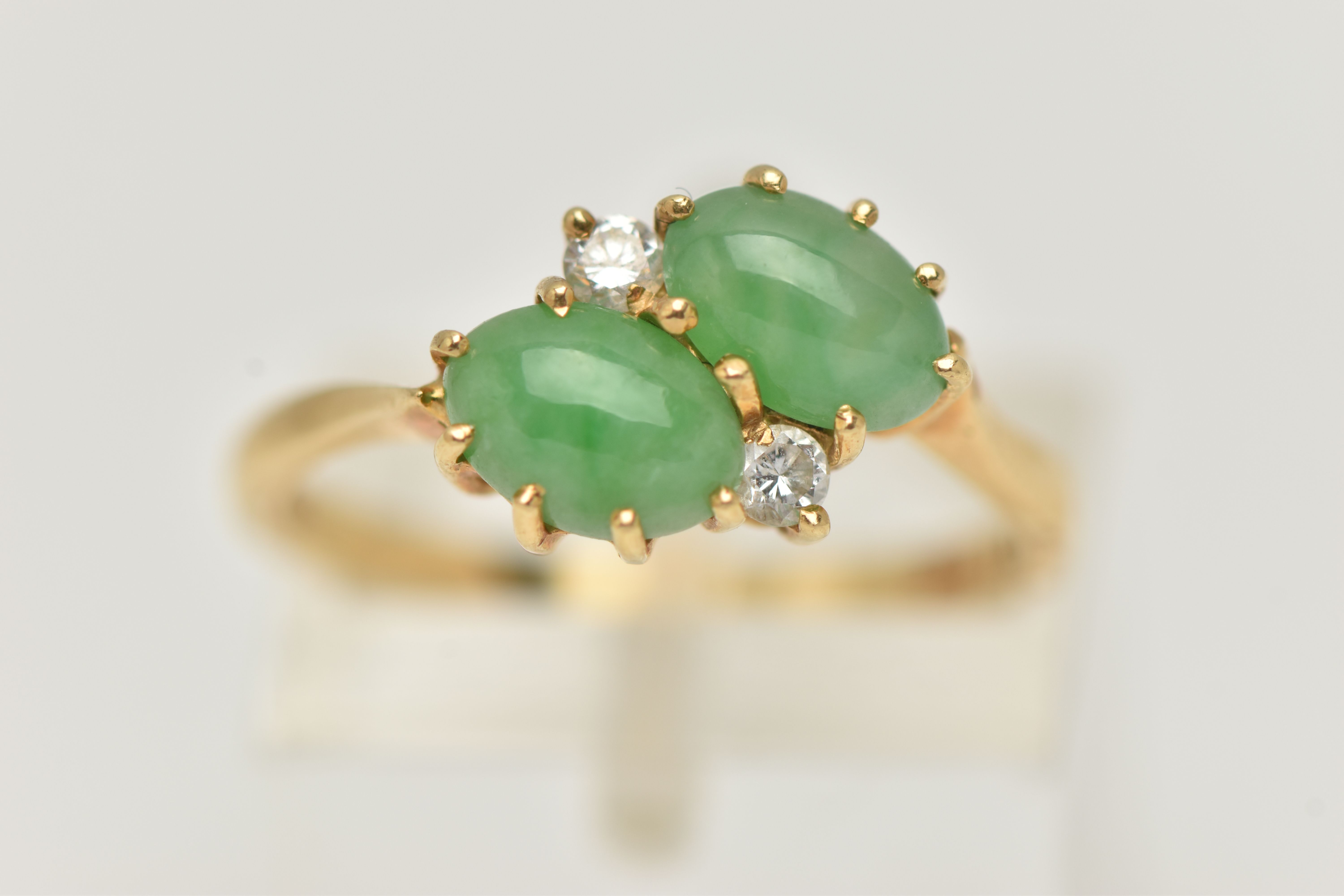 AN 18CT GOLD JADE AND DIAMOND RING, of crossover design, claw set horizontally with two oval jade - Image 5 of 5