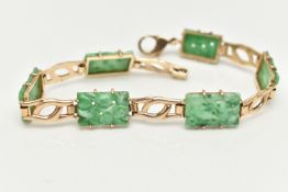 A 9CT GOLD JADE PANEL BRACELET, the rectangular jade panels carved to depict fruits and foliage,