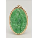 A 9CT GOLD CARVED JADE PENDANT, the oval jade panel carved to depict flowers, foliage and possibly