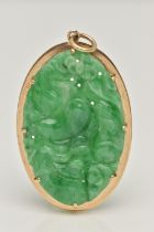 A 9CT GOLD CARVED JADE PENDANT, the oval jade panel carved to depict flowers, foliage and possibly