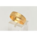A 22CT GOLD TEXTURED BAND, approximate band width 5.9mm, hallmarked 22ct Sheffield, ring size Q
