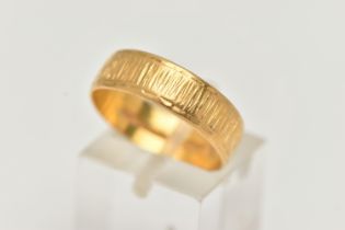 A 22CT GOLD TEXTURED BAND, approximate band width 5.9mm, hallmarked 22ct Sheffield, ring size Q