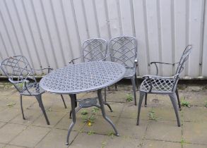 A GREY PAINTED ALUMINIUM GARDEN SET comprising of a 100cm diameter round table with pierced linear
