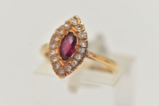 AN 18CT GOLD RUBY AND DIAMOND RING, a marquise cut ruby prong set in yellow gold, set with a