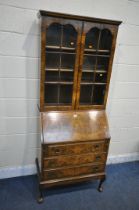 A 20TH CENTURY WALNUT BUREAU BOOKCASE, the top with double glazed doors, enclosing three shelves,