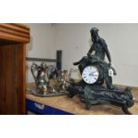 A FIGURAL MANTEL CLOCK AND AN ONEIDA PLATED TEA AND COFFEE SET, comprising a resin figural mantel