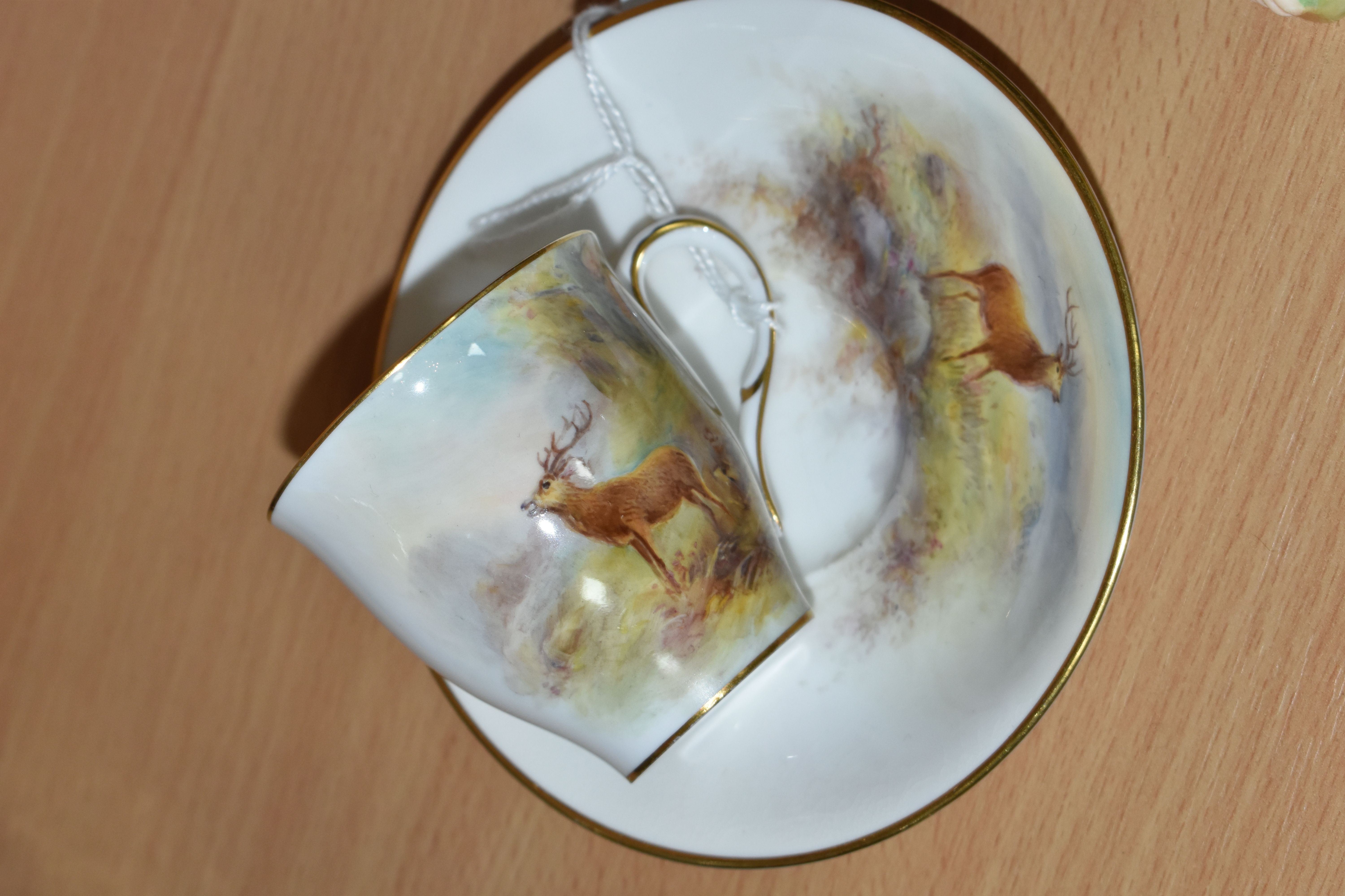 A ROYAL WORCESTER 'MAPLE' CABINET CUP AND SAUCER BY HARRY STINTON, painted with stags in a - Image 2 of 5