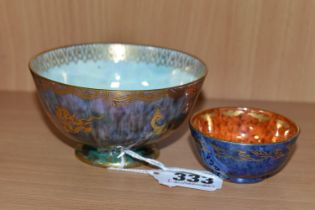 TWO WEDGWOOD LUSTRE BOWLS, comprising a small bowl of mottled purple and green exterior and mother