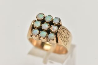 A 9CT GOLD OPAL RING, large square shape ring, set with nine circular cut opal cabochons, each in